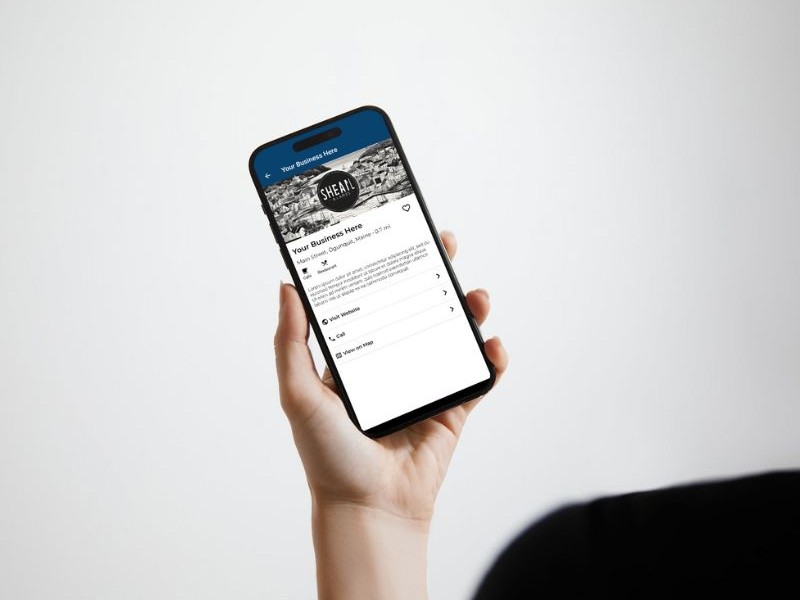 A hand holding a cell phone